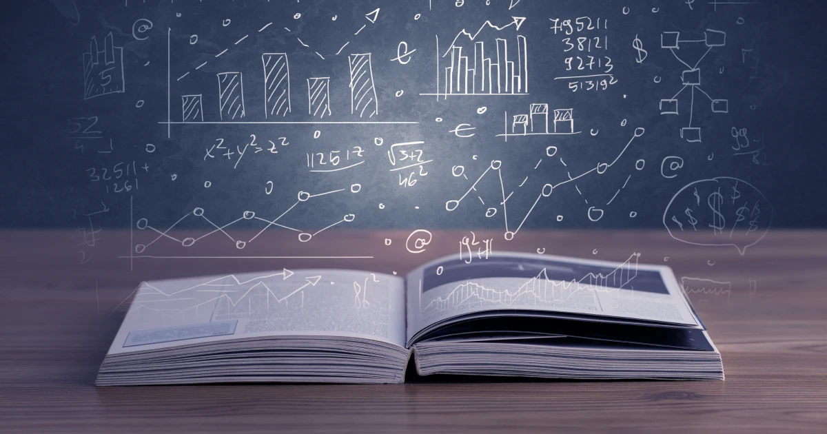 An image of a book with charts coming out of the pages.