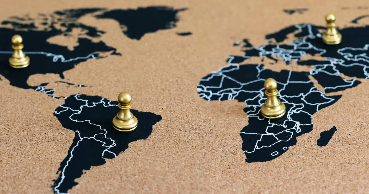An image showing chess pieces on a map of the world representing how geopolitics will impact the future of supply chain. 