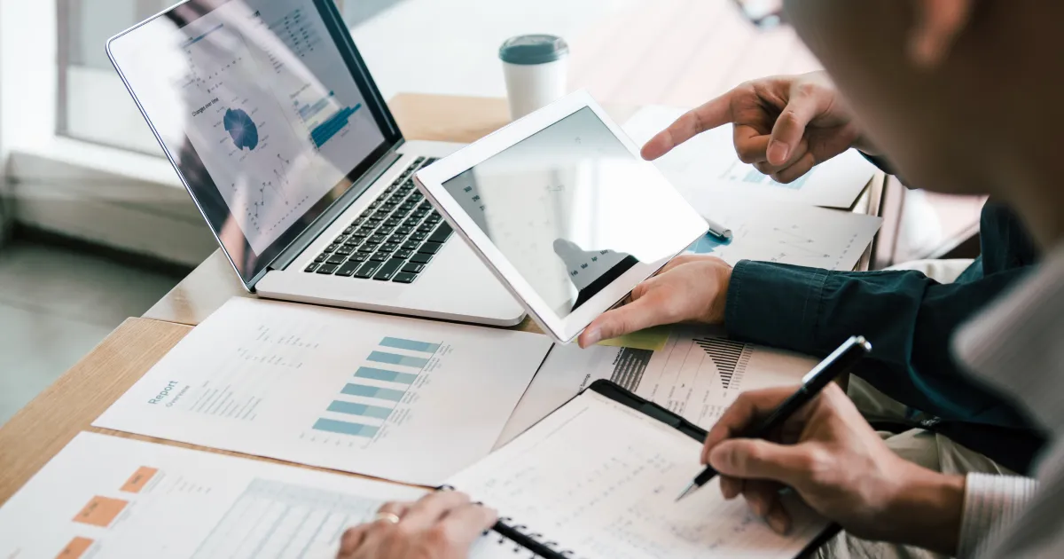 Two people looking at data and planning 