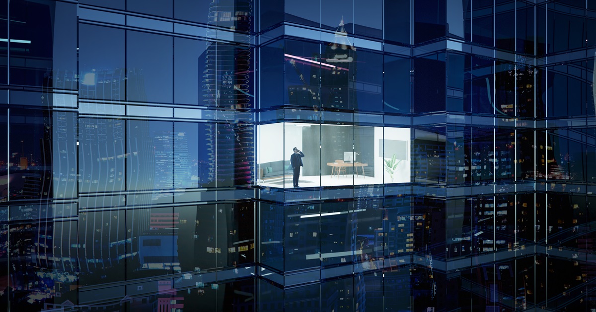 Businessman using mobile phone to talk business in office. View from the outside 3D rendering commercial skyscraper.